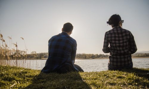 relaxed-couple-resting-lawn relaxed-couple-resting-lawn