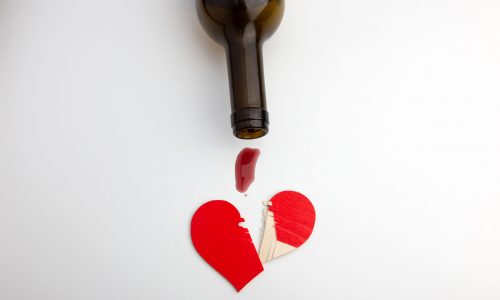 wine dripped from a bottle on a broken heart